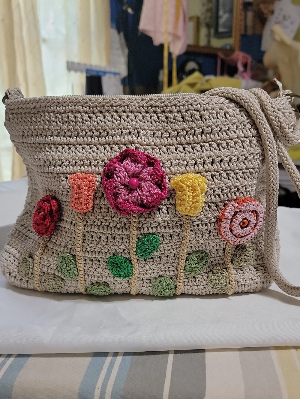 The Sak Beige Crochet Crossbody with Pink, Red, Yellow & Green Floral Appliqués